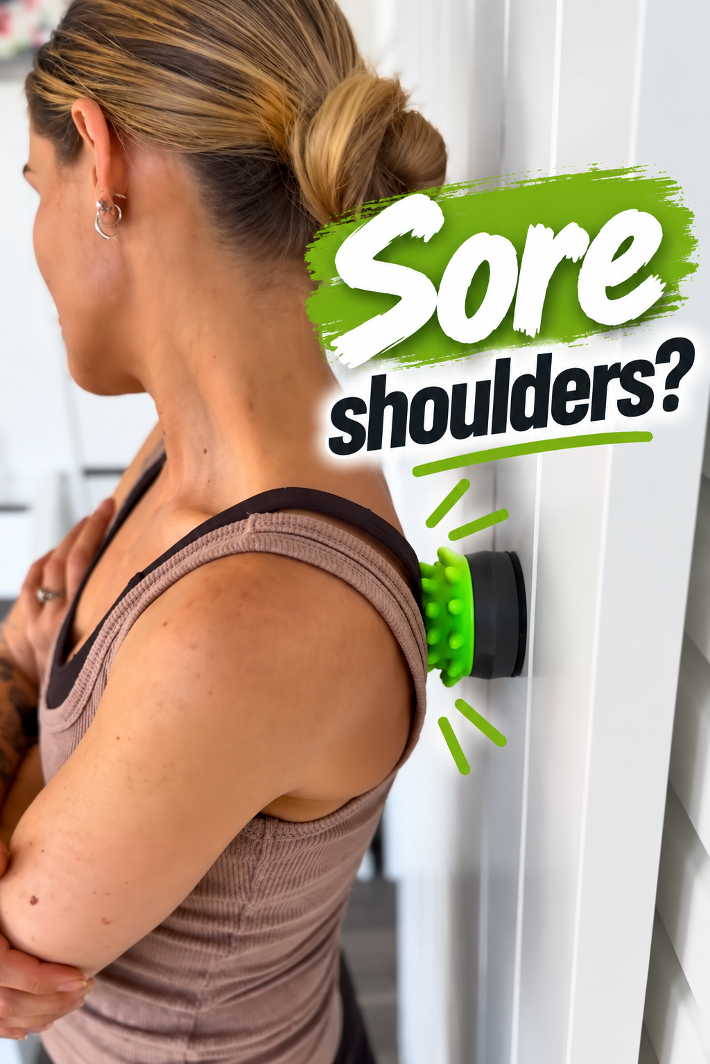 Woman using the xMount wall-mounted massage tool for upper-back and shoulder tension
